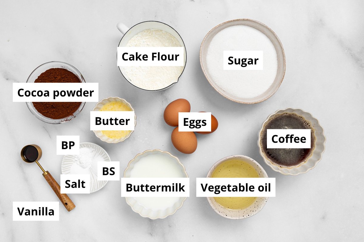 ingredients for matilda chocolate cake and fudge frosting in bowls