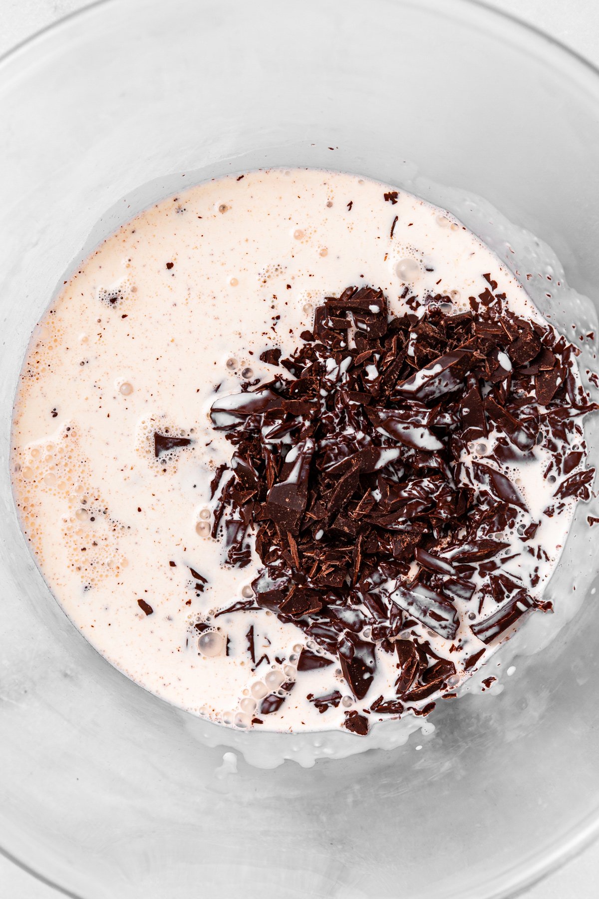 hot cream poured over chopped dark chocolate for fudge frosting