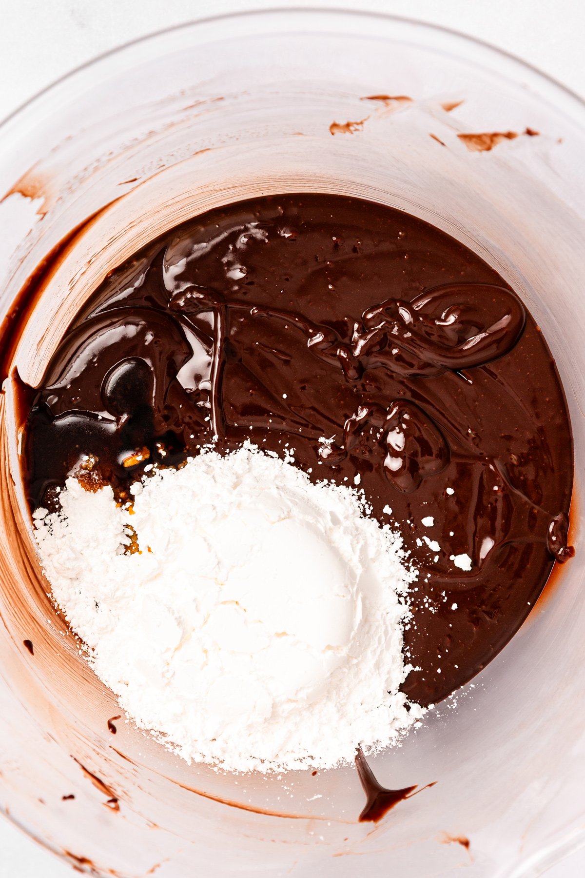 chocolate fudge frosting with powdered sugar and vanilla