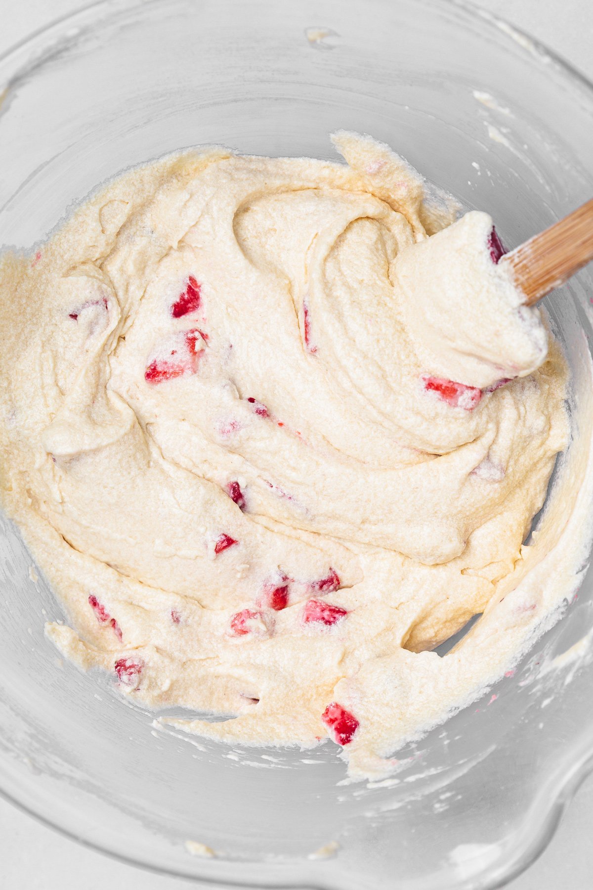 vanilla strawberry cupcake batter with fresh strawberry pieces