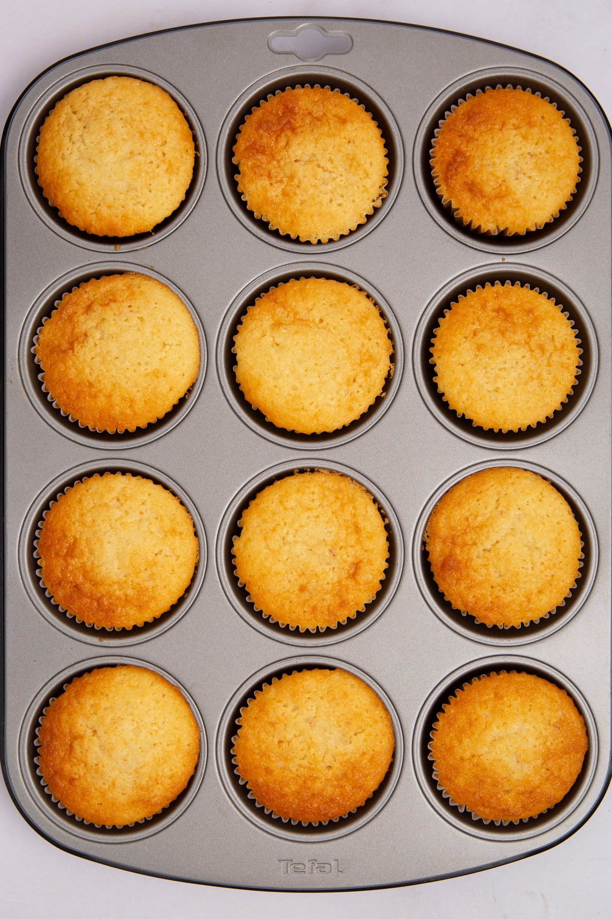 fresh strawberry cupcakes baking in a cupcake pan