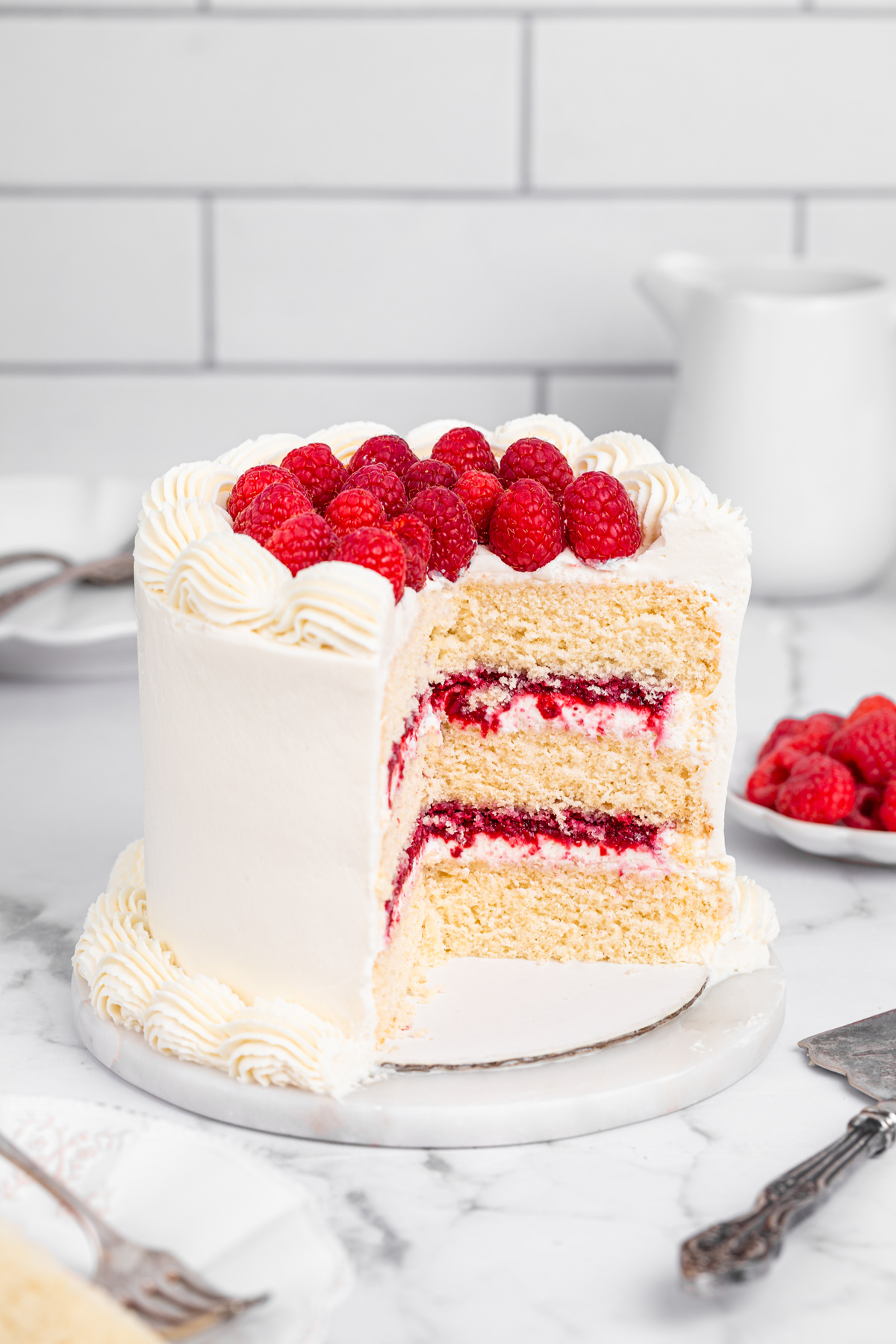 Slice of raspberry mascarpone cake on a table