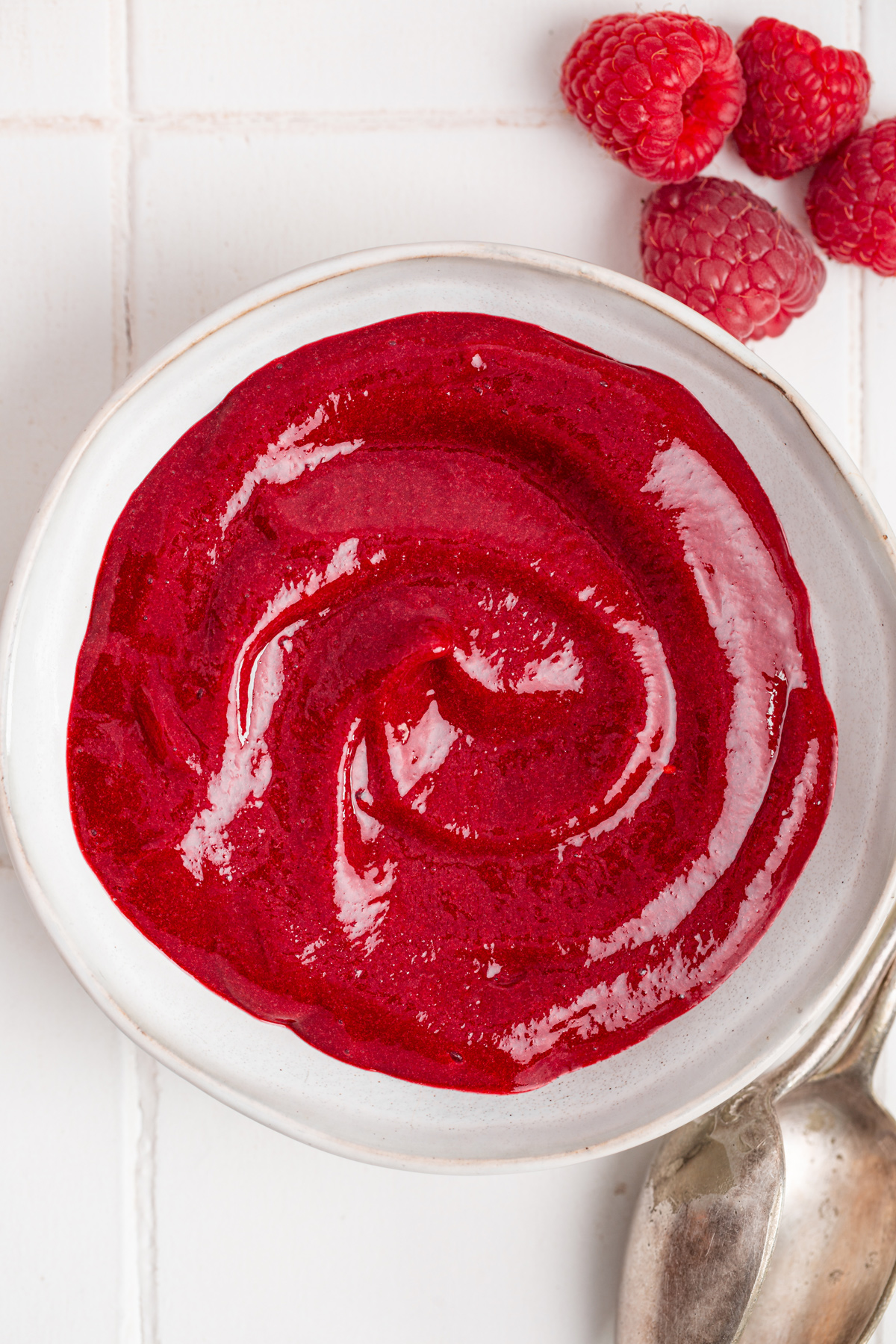 Smooth homemade raspberry puree ready to use