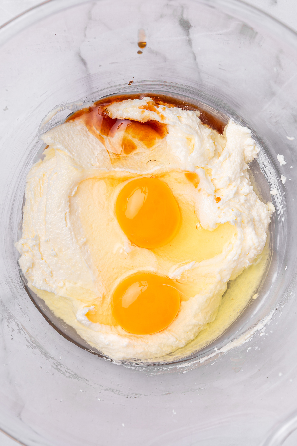 butter, sugar, eggs and vanilla mixed in a bowl for black cocoa cupcakes