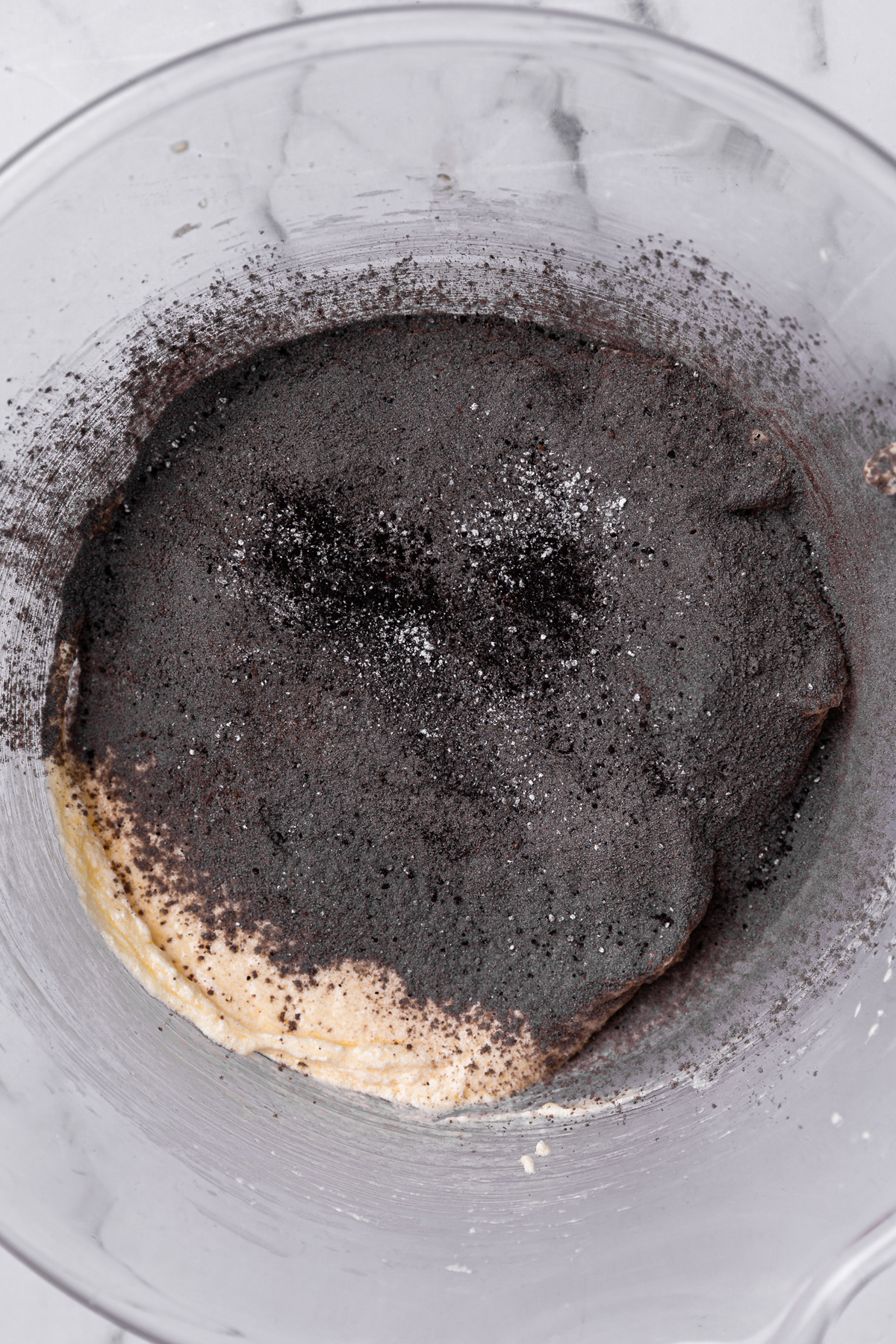 black cocoa cupcake batter with sifted flour and cocoa mixture
