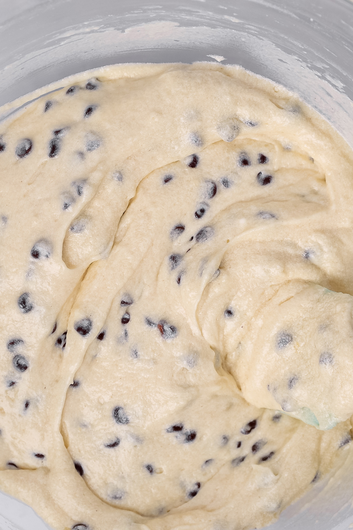 Vanilla cupcake batter mixed with mini chocolate chips