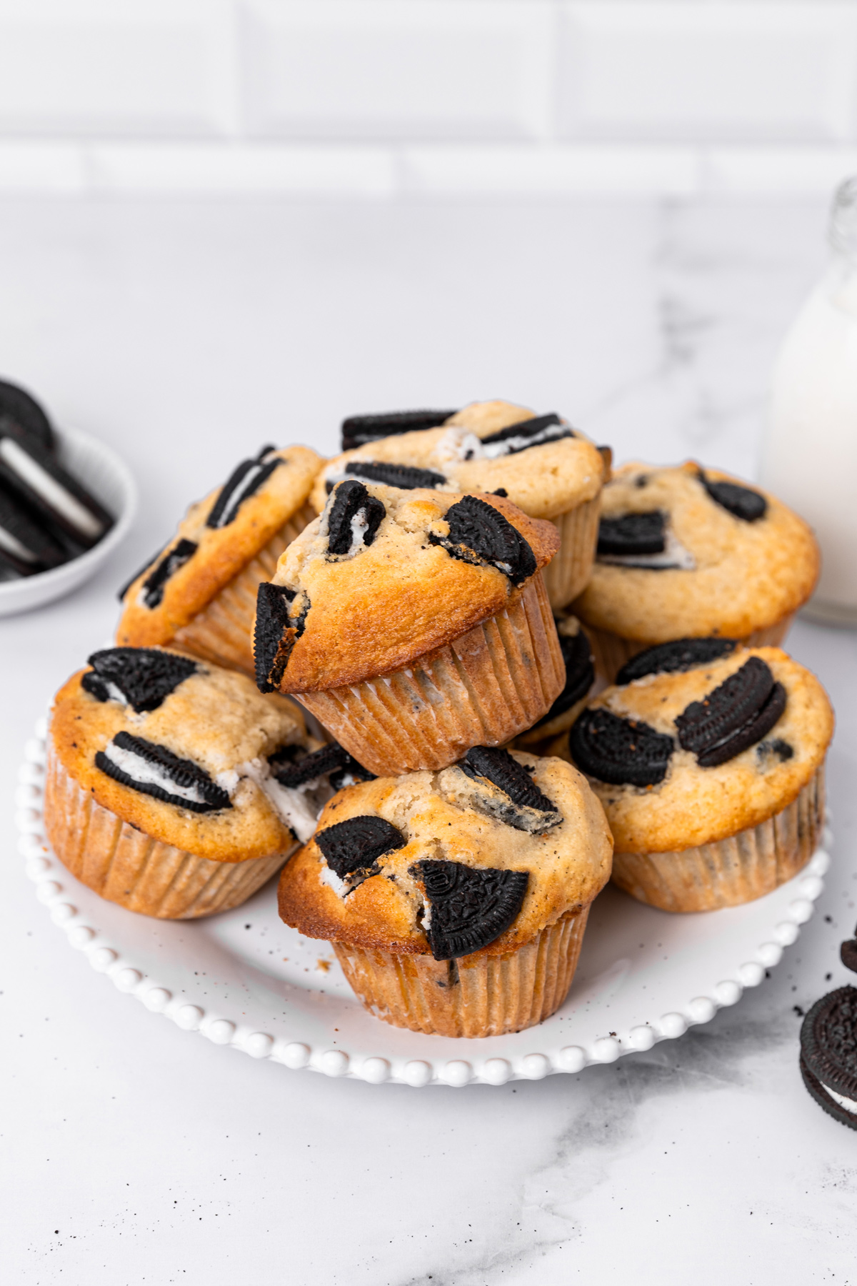 Oreo muffins with cookie pieces on a serving plate