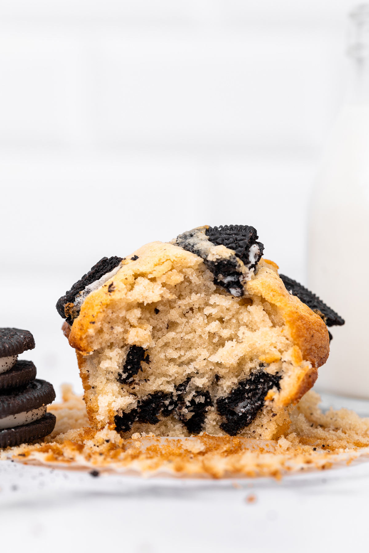Oreo muffin cut in half showing the soft crumb
