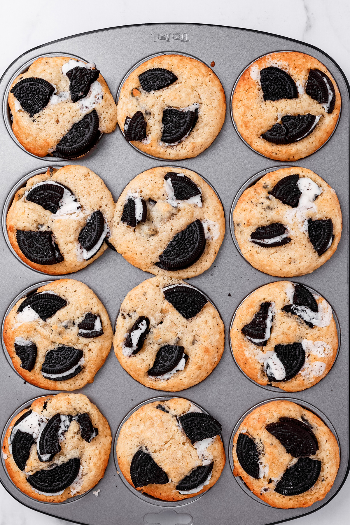 Freshly baked Oreo muffins in a muffin pan