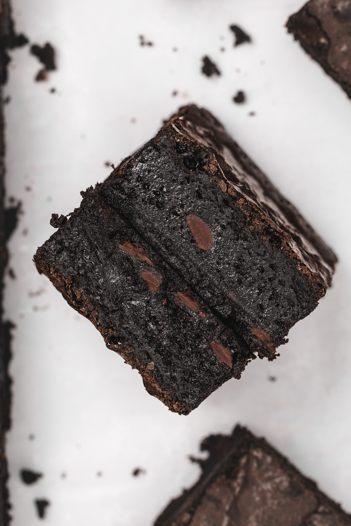 Fudgy black cocoa brownie showing the center
