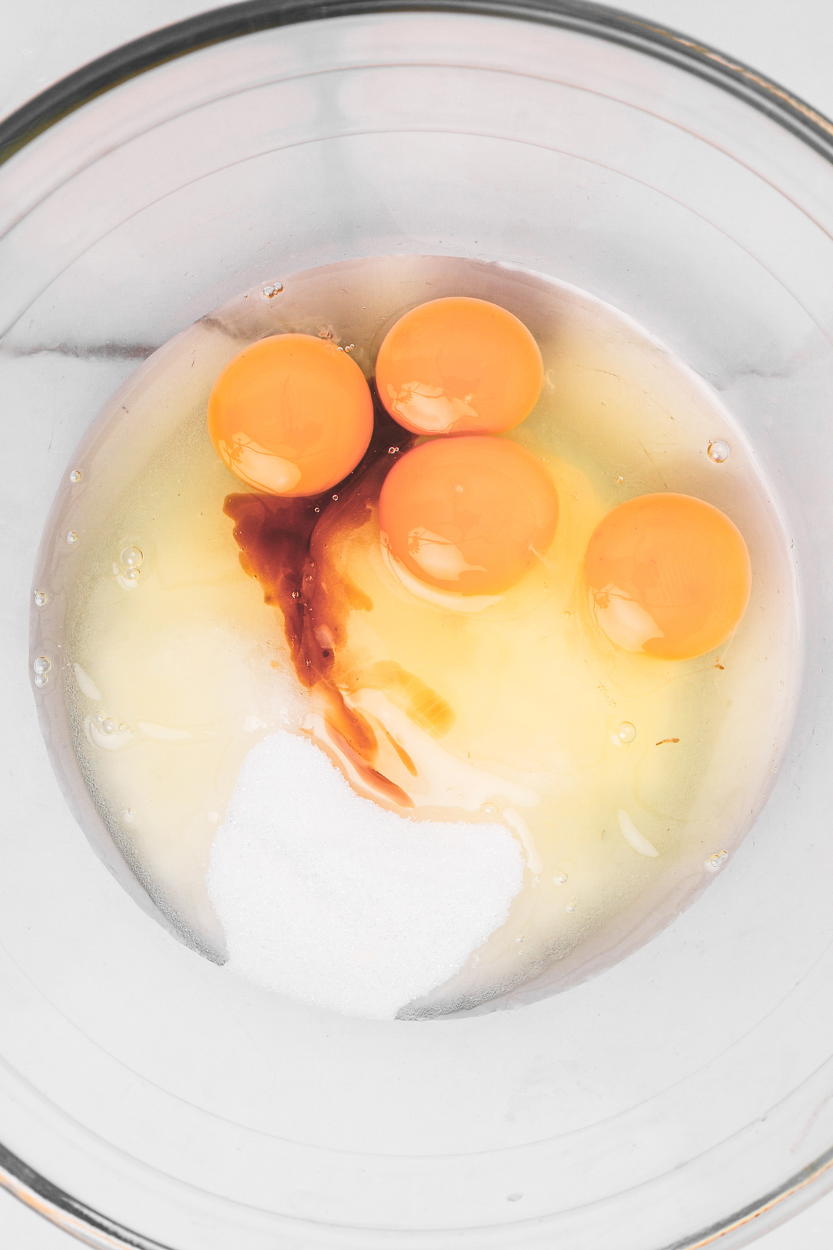 Eggs, sugar and vanilla for black cocoa brownies