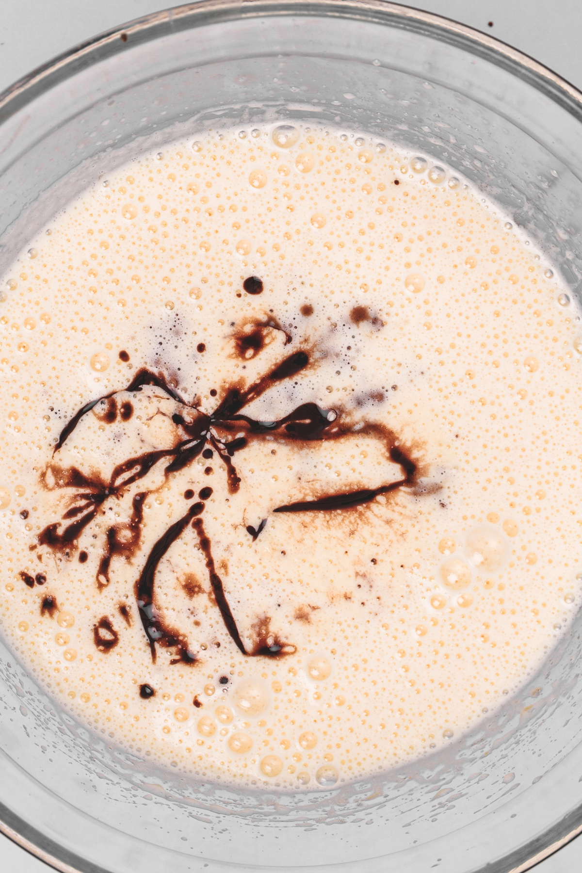 Whipped eggs and sugar with melted chocolate mixture