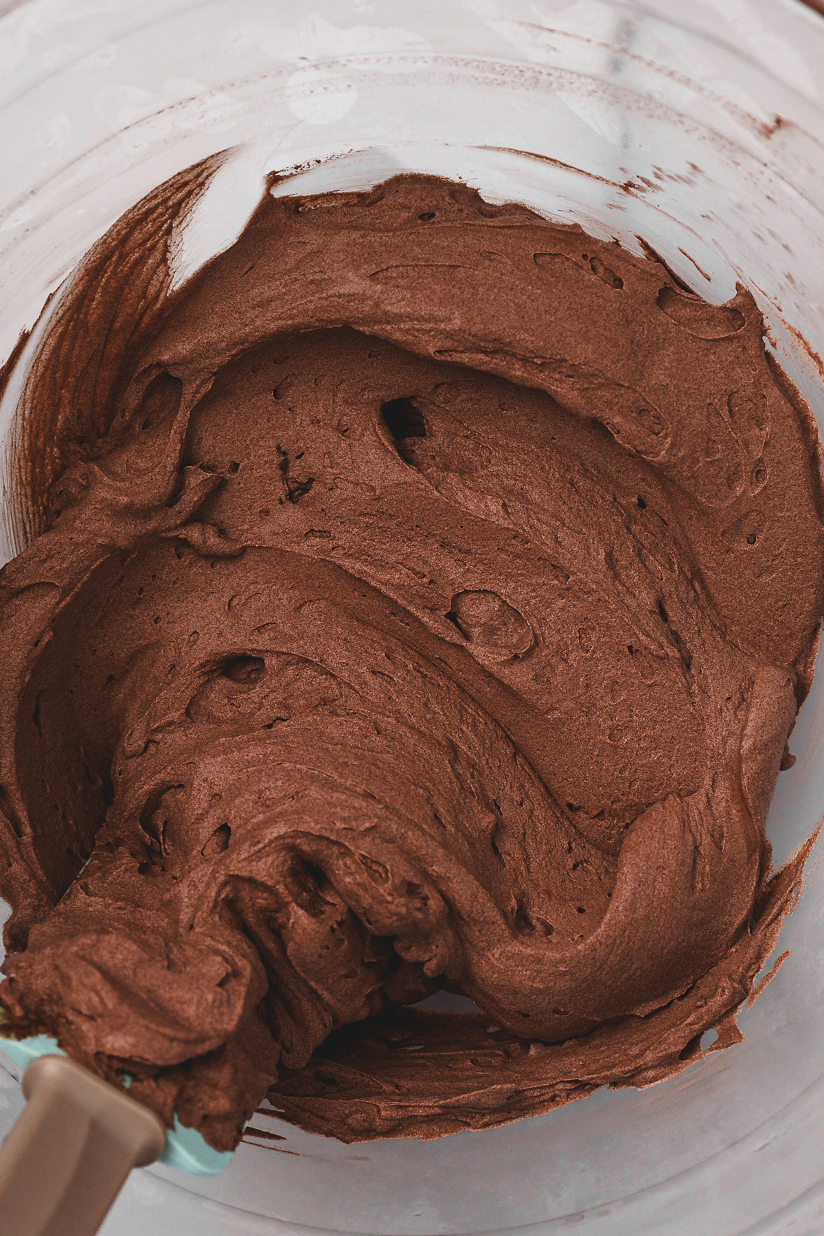 Fresh homemade chocolate whipped cream in a mixing bowl
