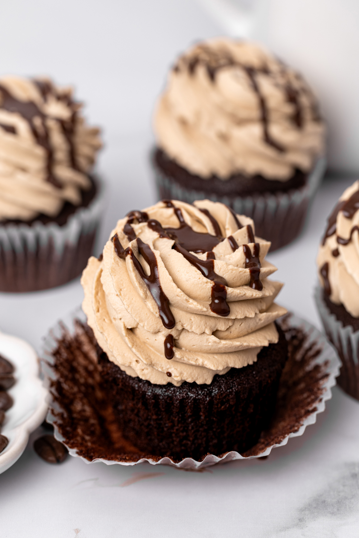 Homemade mocha cupcakes with coffee ganache and chocolate drizzle