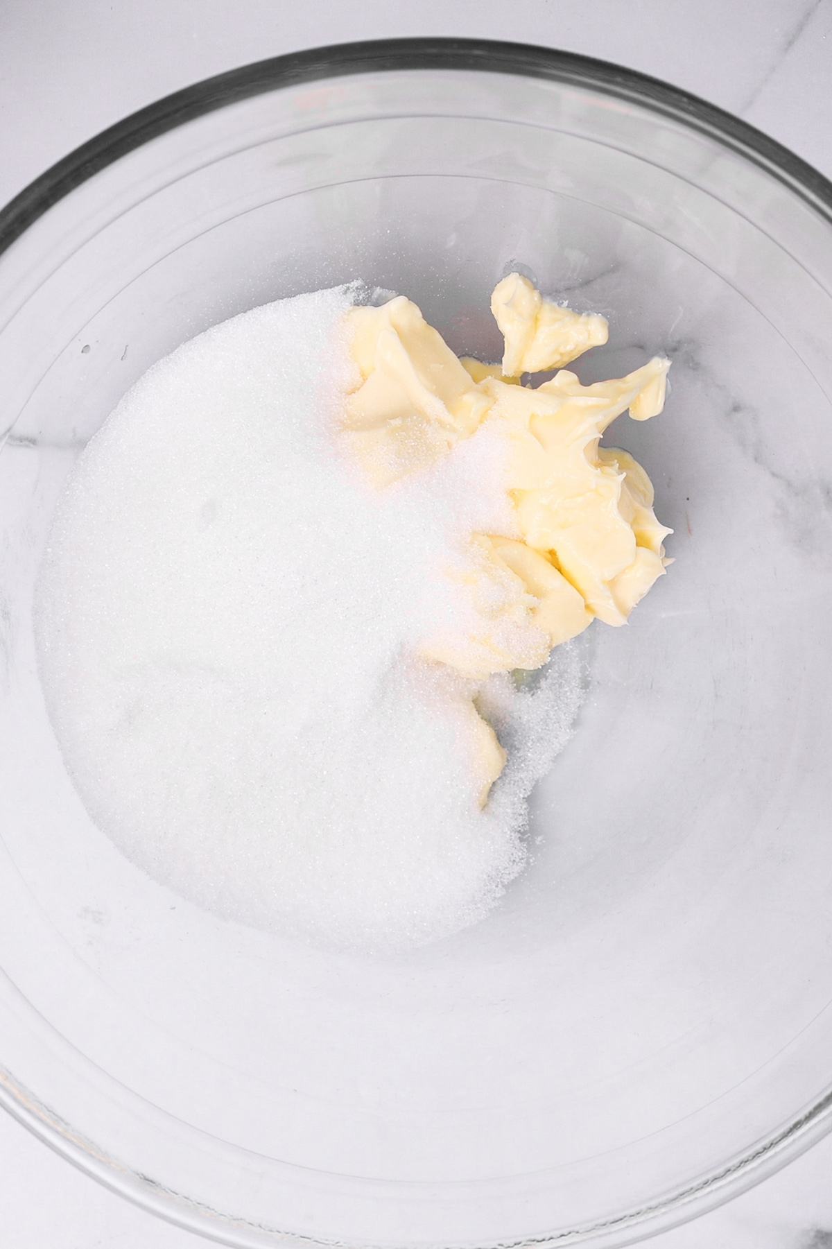 Butter and sugar in a mixing bowl